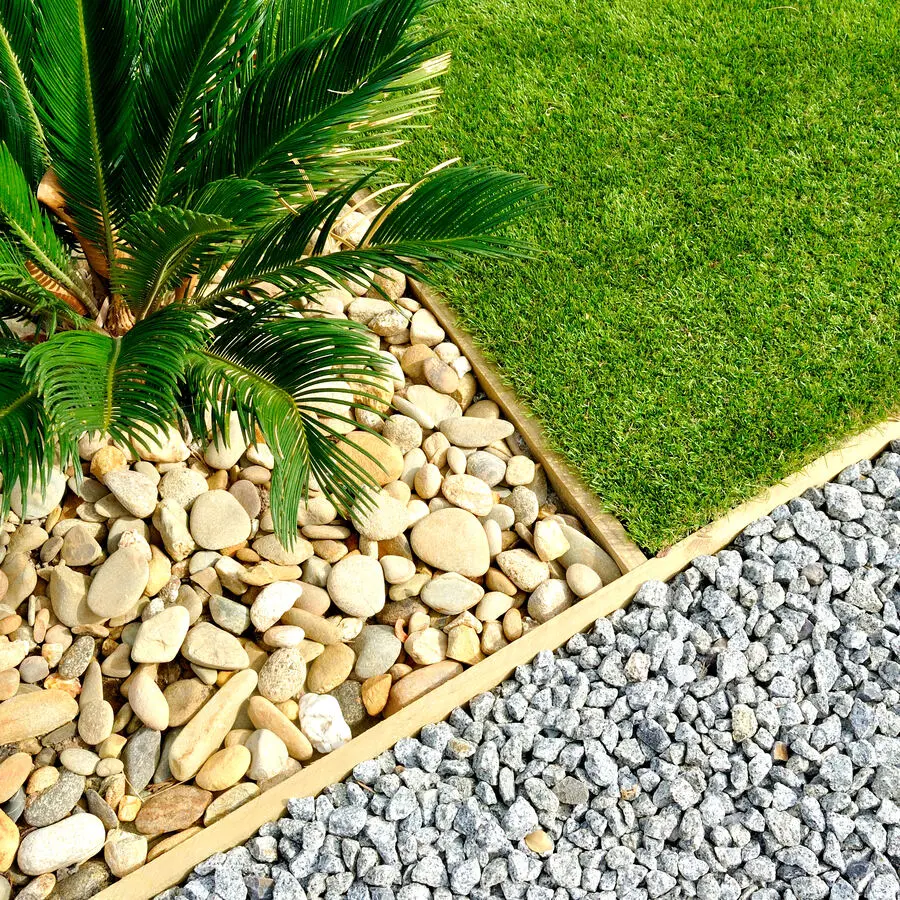 Pebble rocks and gravel installed in a landscape design